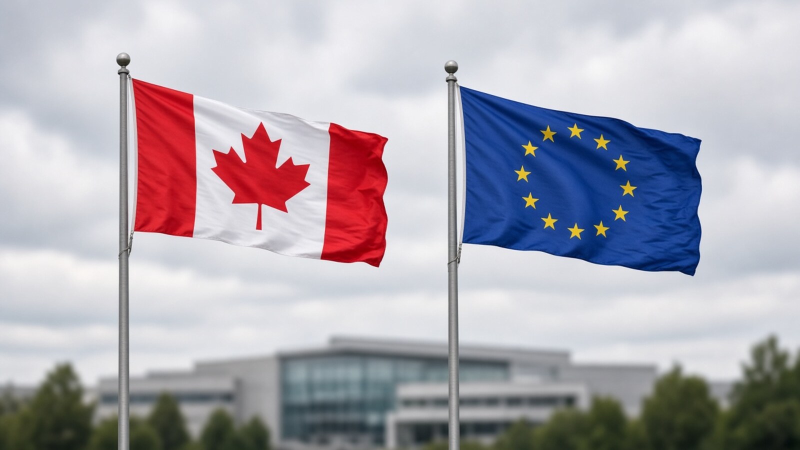 Canadian and European Union flags flying side by side outdoors